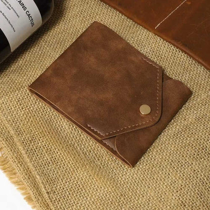 compact leather wallet with pen on burlap background
